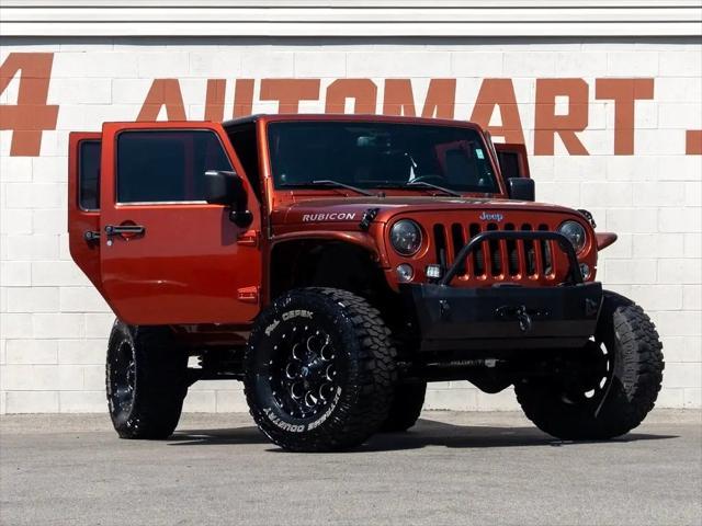 used 2014 Jeep Wrangler Unlimited car, priced at $26,744