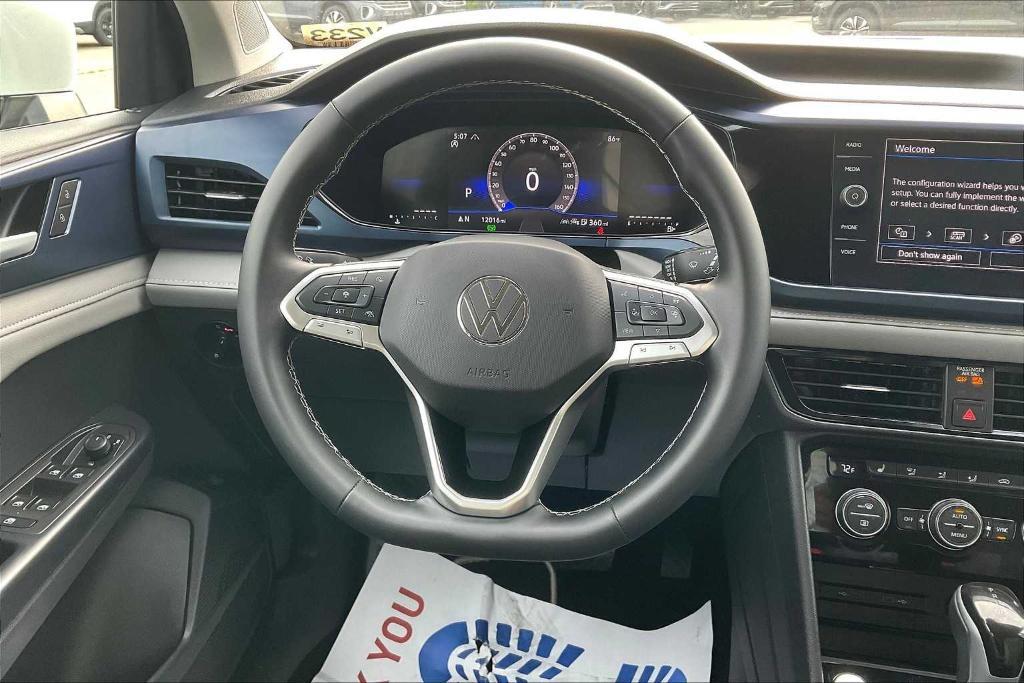 used 2024 Volkswagen Taos car, priced at $26,200