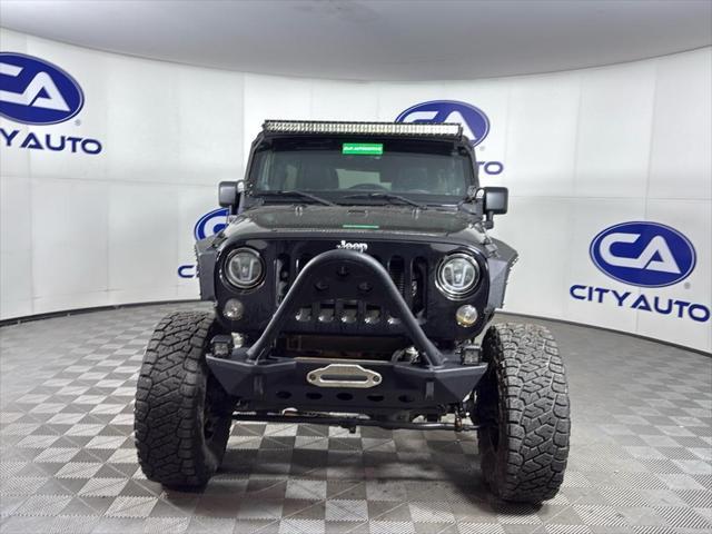 used 2014 Jeep Wrangler Unlimited car, priced at $17,500