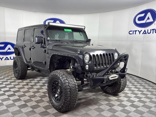 used 2014 Jeep Wrangler Unlimited car, priced at $17,500