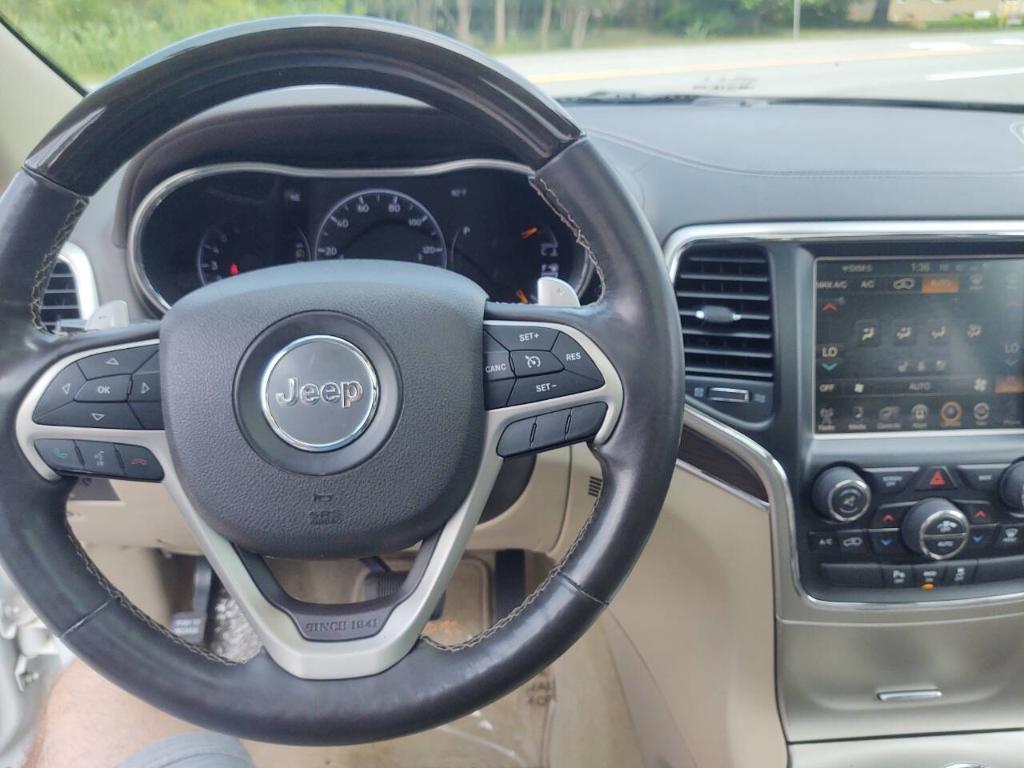 used 2014 Jeep Grand Cherokee car, priced at $14,295