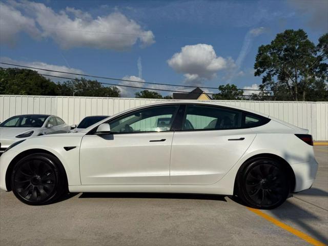 used 2023 Tesla Model 3 car, priced at $27,575