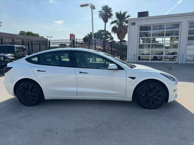 used 2023 Tesla Model 3 car, priced at $27,575