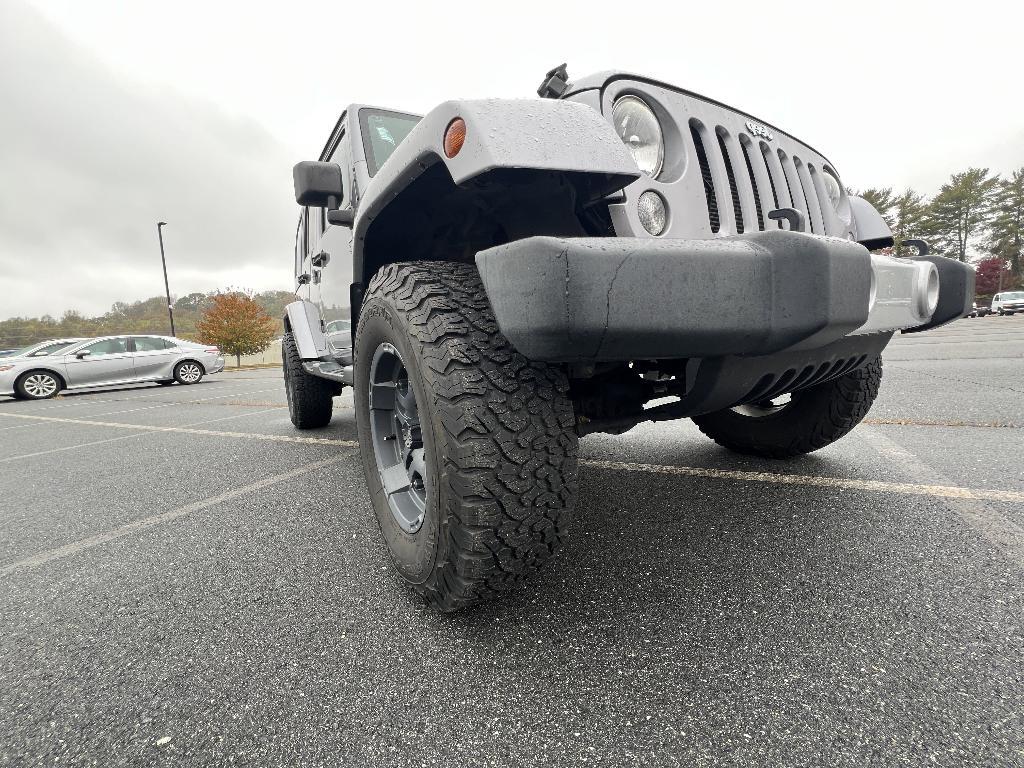 used 2014 Jeep Wrangler Unlimited car, priced at $19,393