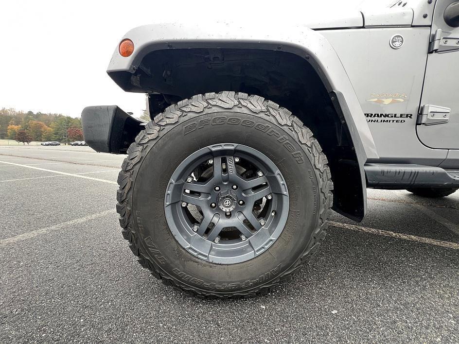 used 2014 Jeep Wrangler Unlimited car, priced at $19,393