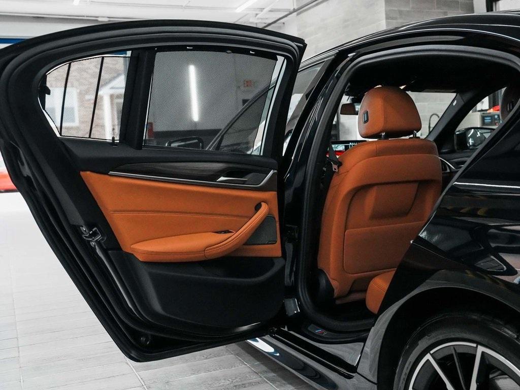 used 2023 BMW 530e car, priced at $30,890