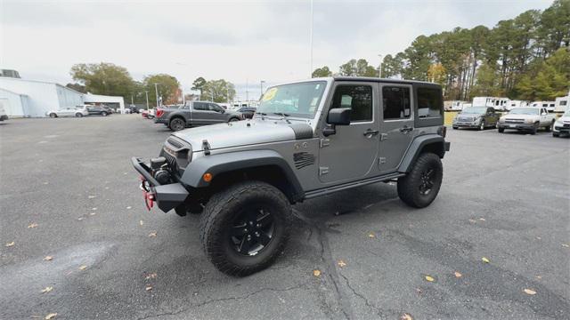 used 2016 Jeep Wrangler Unlimited car, priced at $19,873