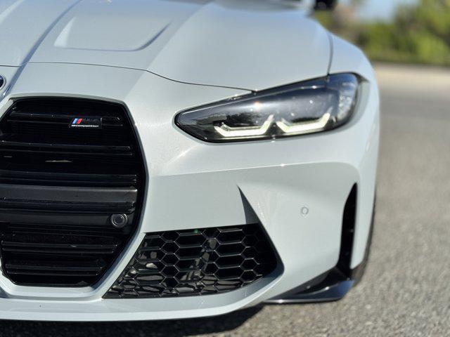 used 2022 BMW M4 car, priced at $74,100