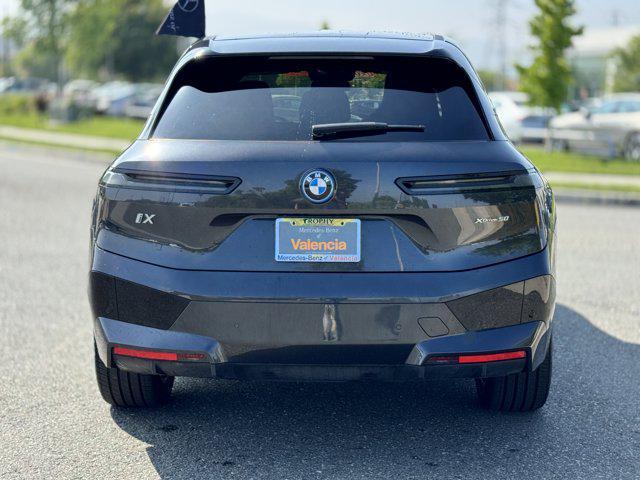 used 2024 BMW iX car, priced at $53,600