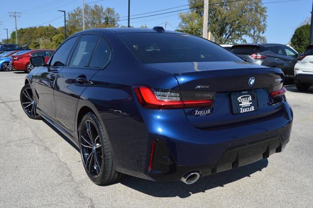 used 2023 BMW 330e car, priced at $38,130