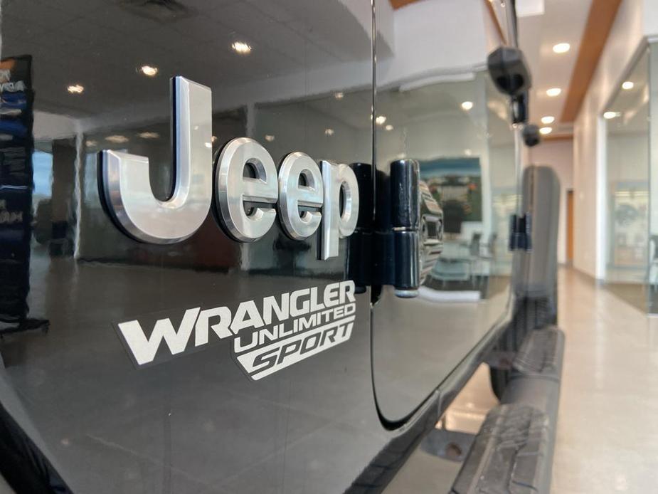 used 2021 Jeep Wrangler Unlimited car, priced at $31,339