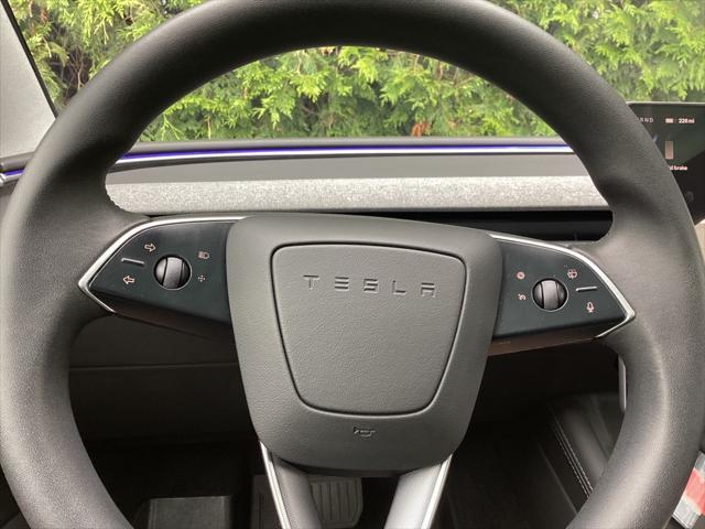 used 2025 Tesla Model 3 car, priced at $34,981