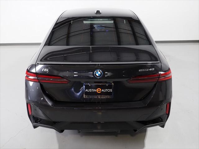used 2025 BMW i5 car, priced at $61,950