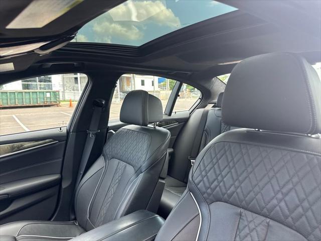 used 2023 BMW M550 car, priced at $70,989