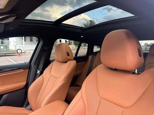 used 2025 BMW X4 car, priced at $55,989