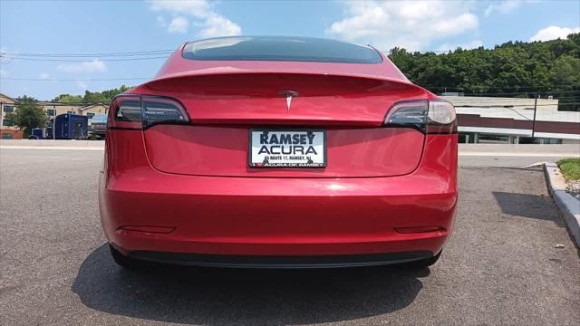 used 2023 Tesla Model 3 car, priced at $24,495