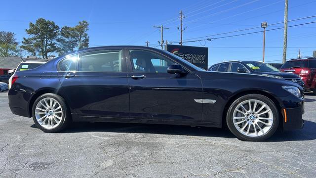 used 2015 BMW 750 car, priced at $16,599