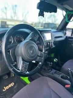 used 2014 Jeep Wrangler Unlimited car, priced at $10,900