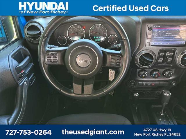 used 2015 Jeep Wrangler Unlimited car, priced at $17,440