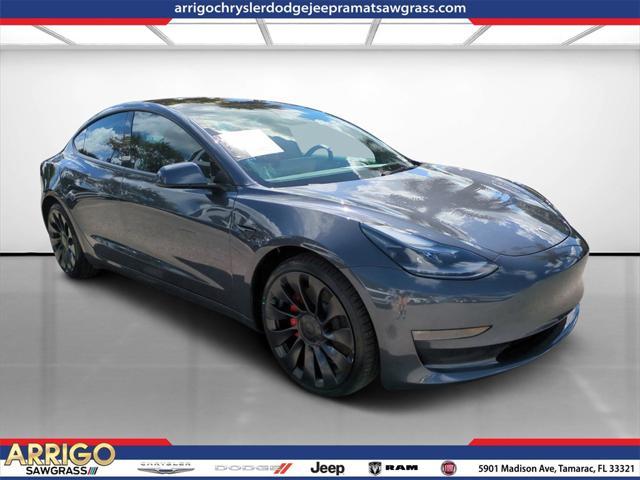 used 2023 Tesla Model 3 car, priced at $33,900