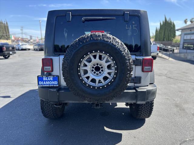 used 2014 Jeep Wrangler Unlimited car, priced at $18,999