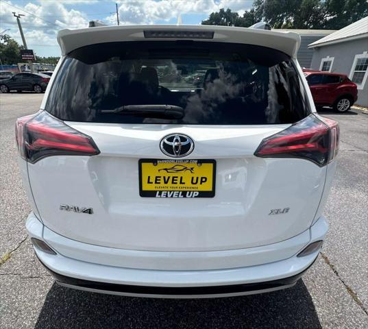 used 2018 Toyota RAV4 car, priced at $15,990
