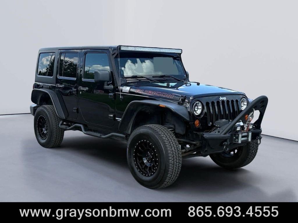 used 2011 Jeep Wrangler Unlimited car, priced at $15,378