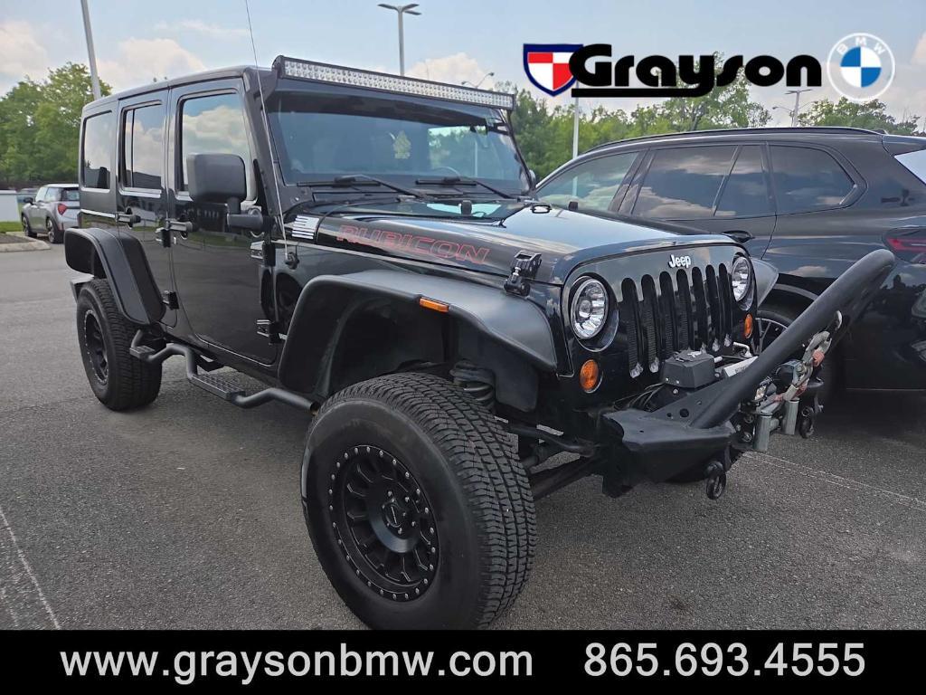 used 2011 Jeep Wrangler Unlimited car, priced at $15,378