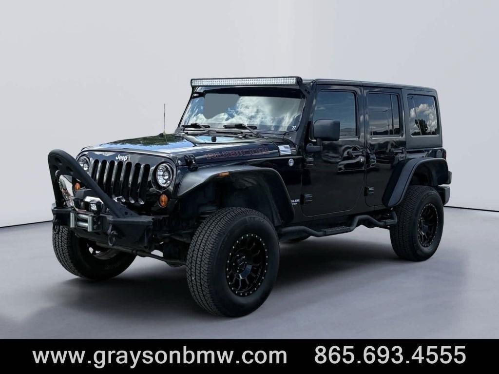 used 2011 Jeep Wrangler Unlimited car, priced at $15,378