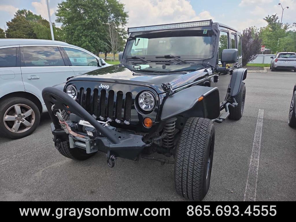 used 2011 Jeep Wrangler Unlimited car, priced at $15,378