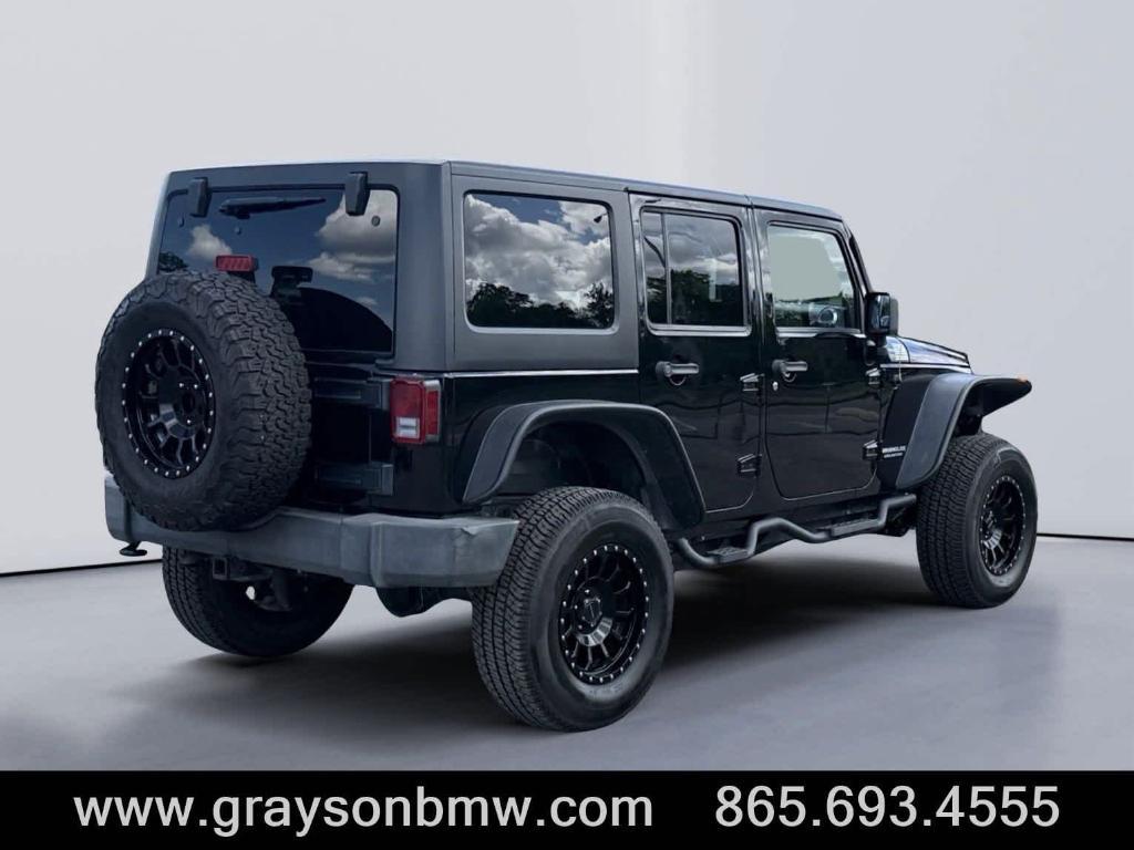 used 2011 Jeep Wrangler Unlimited car, priced at $15,378