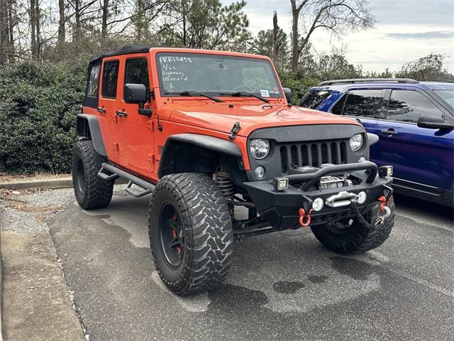 used 2015 Jeep Wrangler Unlimited car, priced at $18,125