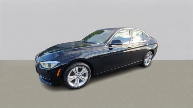 used 2018 BMW 330 car, priced at $19,698