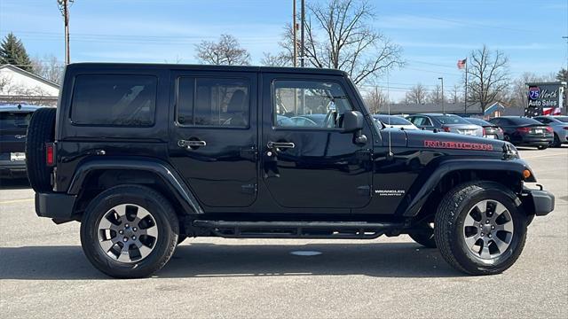 used 2014 Jeep Wrangler Unlimited car, priced at $17,575