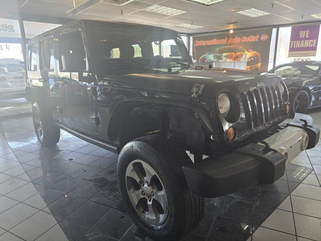 used 2013 Jeep Wrangler Unlimited car, priced at $9,995