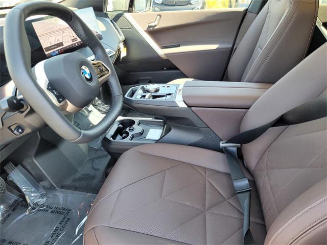 new 2026 BMW iX car, priced at $85,020