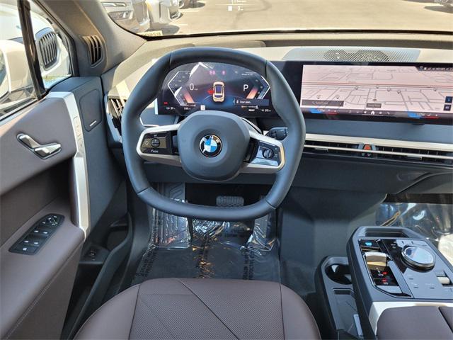 new 2026 BMW iX car, priced at $85,020