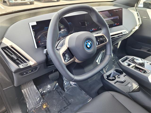 new 2025 BMW iX car, priced at $94,005