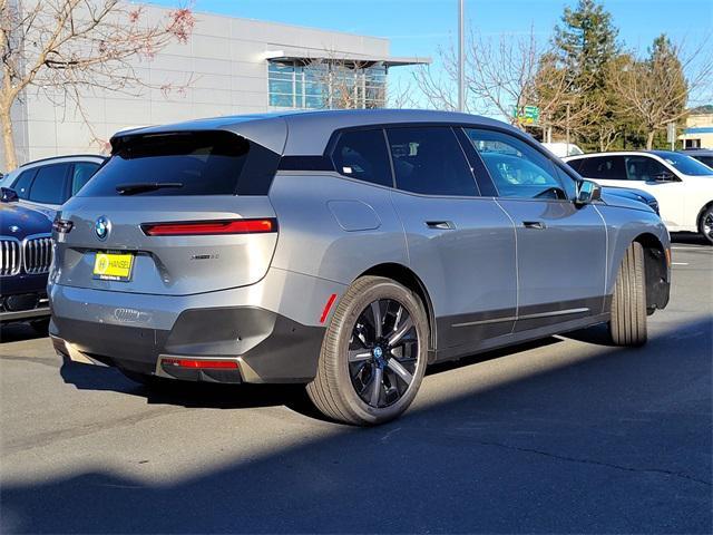 new 2025 BMW iX car, priced at $98,030