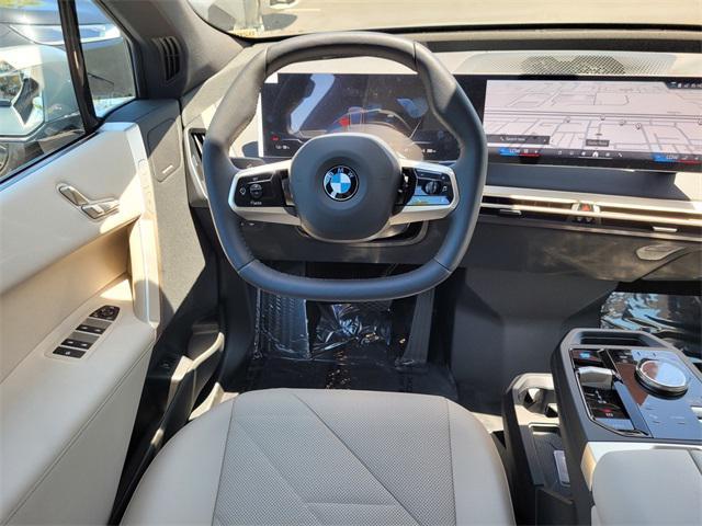 new 2026 BMW iX car, priced at $85,395