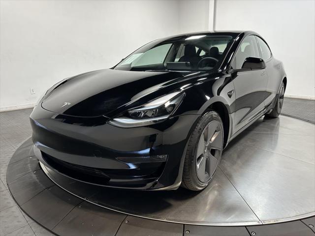 used 2023 Tesla Model 3 car, priced at $30,000