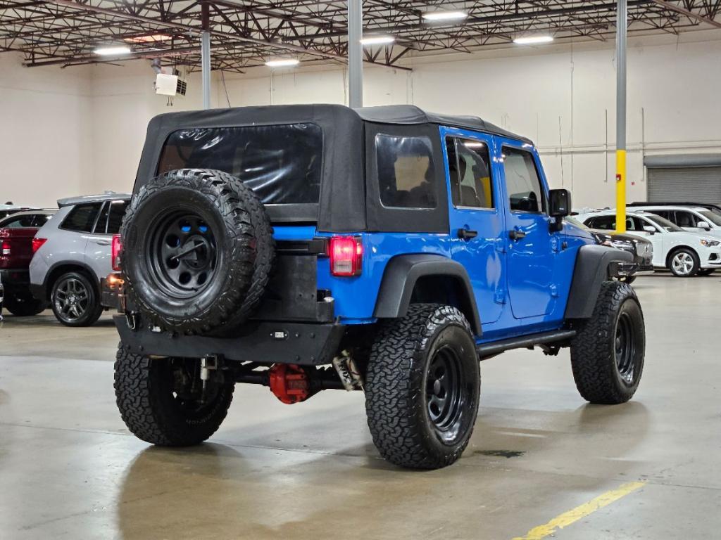 used 2011 Jeep Wrangler Unlimited car, priced at $16,997