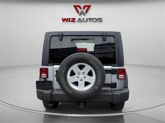 used 2015 Jeep Wrangler Unlimited car, priced at $22,691
