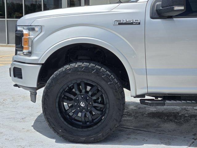 used 2019 Ford F-150 car, priced at $24,047