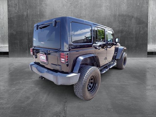used 2011 Jeep Wrangler Unlimited car, priced at $13,598