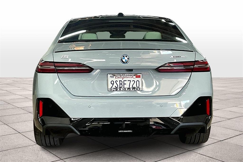 used 2025 BMW i5 car, priced at $72,992