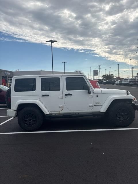used 2013 Jeep Wrangler Unlimited car, priced at $15,797