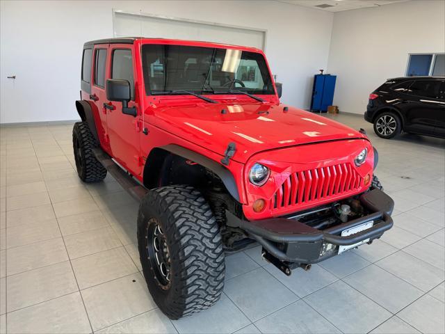 used 2013 Jeep Wrangler Unlimited car, priced at $15,450