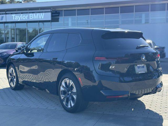 new 2026 BMW iX car, priced at $96,670