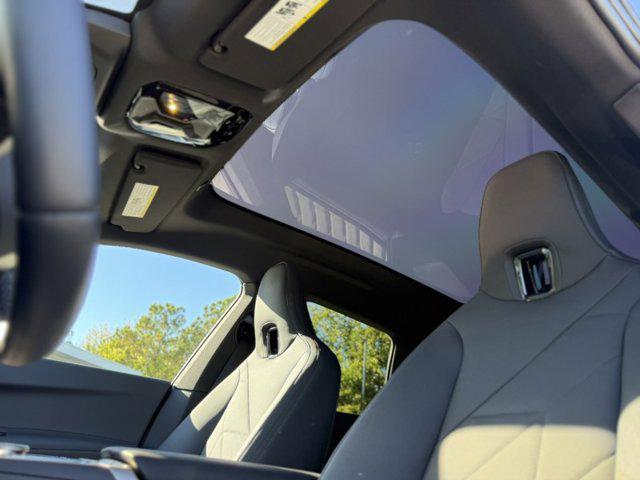 new 2026 BMW iX car, priced at $96,670